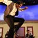 An Irish man doing a jig with his band accompanying him